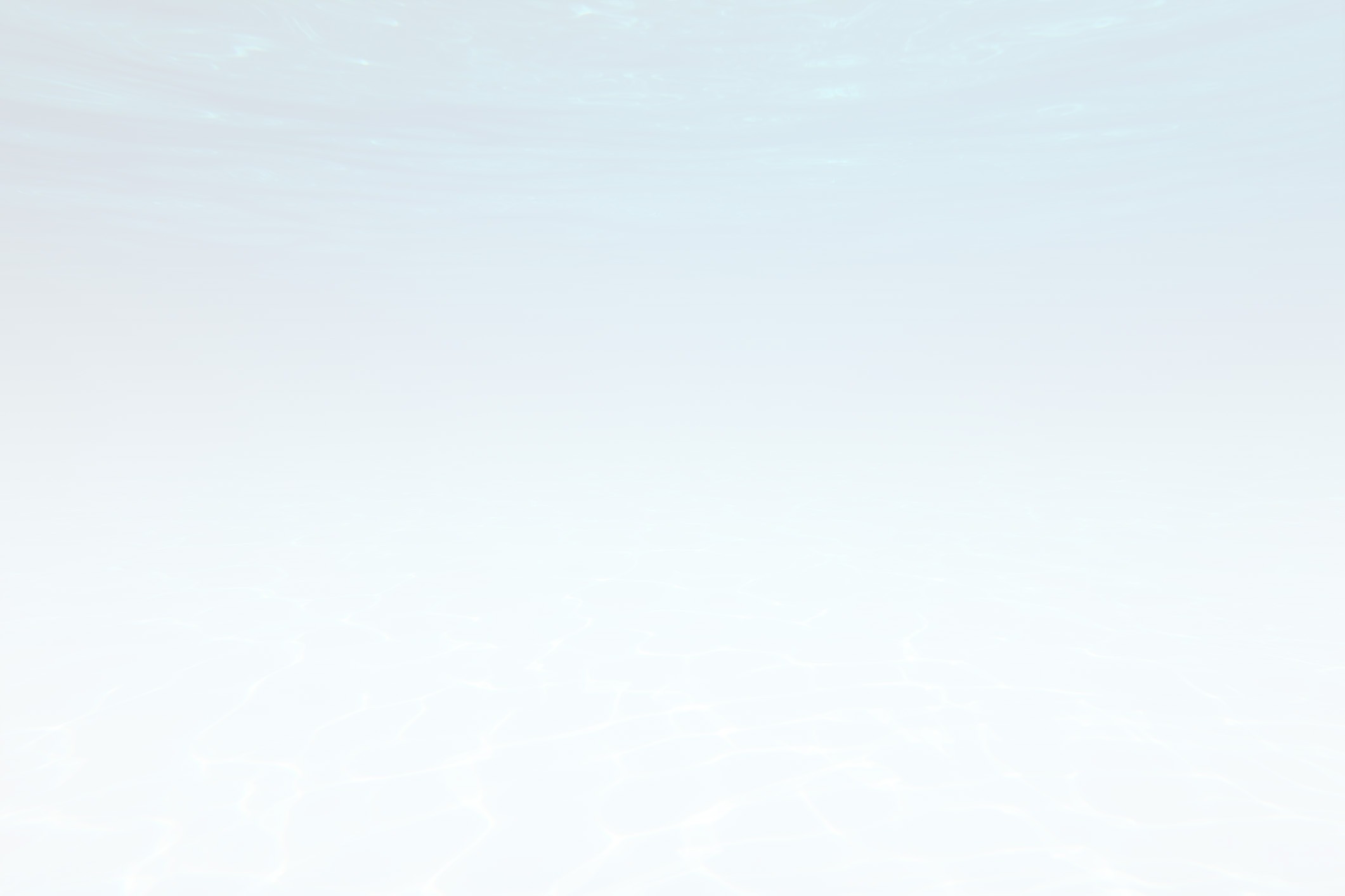 The image shows a tranquil underwater scene with soft lighting, creating an ethereal atmosphere. The bottom is sandy and the water is clear.